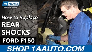 How To Replace Rear Shocks 9703 Ford F150 [upl. by Colbye]